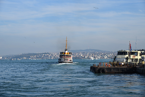 Istanbul, Turkey - December 10, 2023: Istanbul Sehit Ilker Karter ferry in Bosphorus Strait. The ferry is one of oldest  transportation in Istanbul