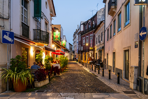 Coimbra, Portugall - August 3, 2023: Illuminated cozy street at evening time