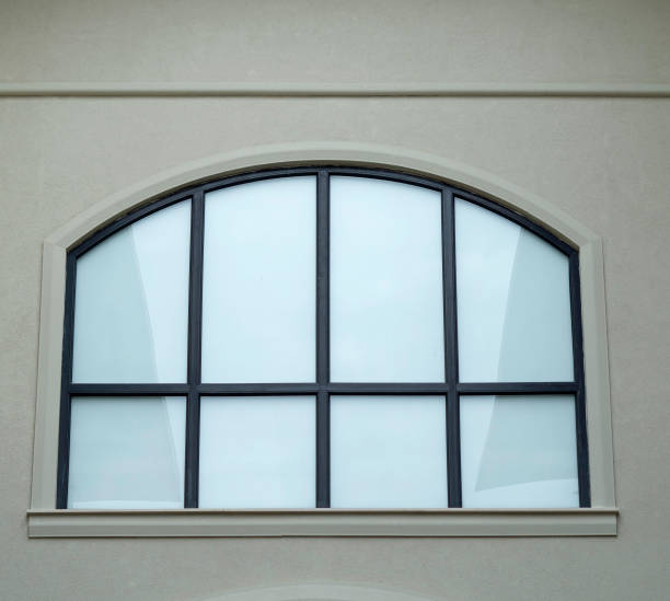 istock New arched window  on white wall closeup 1924848188