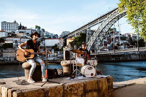 April 17, 2023 - Porto, Portugal: Street band playing in the riverside of touristic Porto