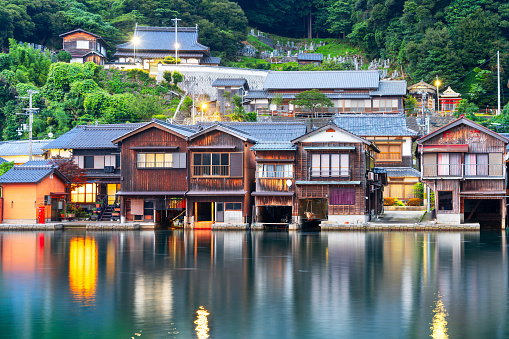 Kyoto, Japan with Funaya boathouses on Ine Bay at dusk.