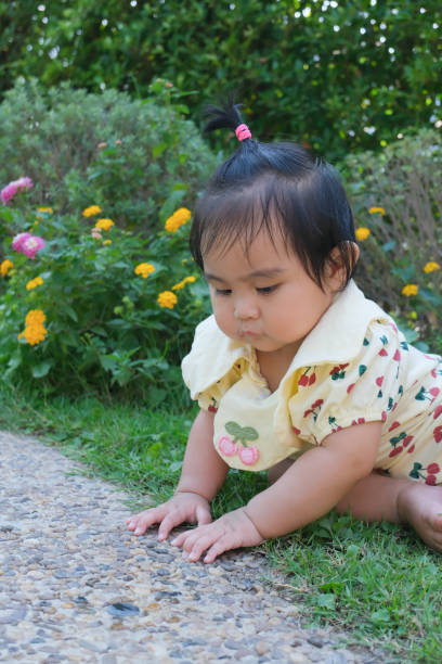 Children are at the age of learning to sit and touch the ground.