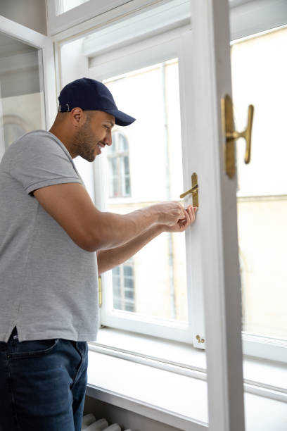 istock Professional handyman fixing window handle at home. 1924941557