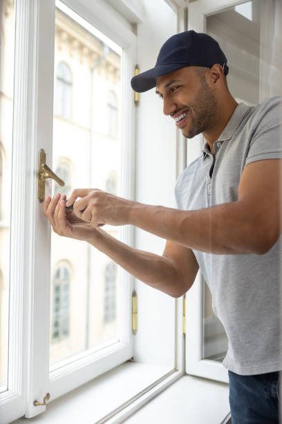 istock Professional handyman fixing window handle in his apartment. 1924941563