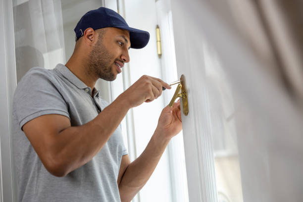 istock Bearded man repairing window handle at home. 1924941565