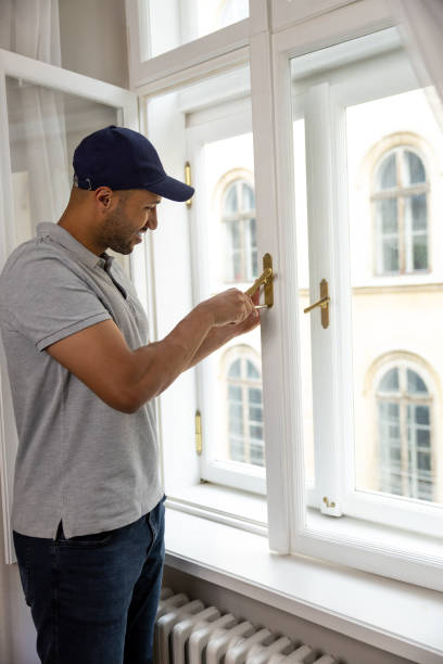 istock Bearded man repairing window handle at home. 1924941567