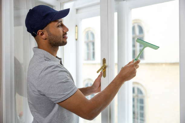 istock Man washing window doing household chores at home. 1924941572