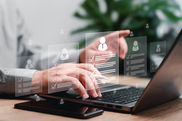 istock HR Management Human Resources document online checklist concept, Businessman search online of best Human Resources for employees to select the qualities of the best people to join the team 1924955891