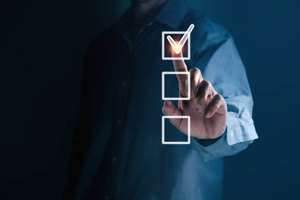 Business Man's hand ticking a check mark Correct with copy space for your text.