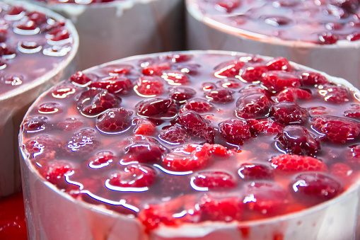 Making cheesecake with raspberries at the factory.