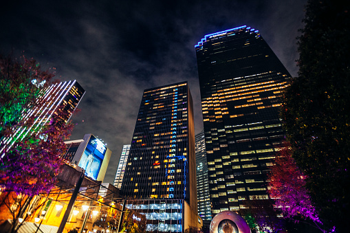 Dallas, Texas, USA - Wide angle view to illuminated street in Dallas downtown.
