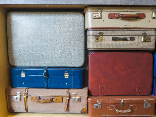 istock vintage suitcases stacked on top each other 1924970545
