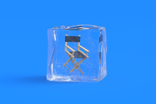 Director chair in ice cube. 3d illustration