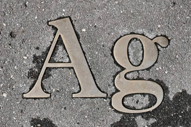 istock Iron worn sign Ag (silver) in asphalt on the road. 1924990704