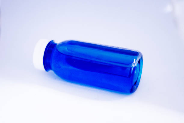 Tethered Bottle Cap Open, bottle of orange juice