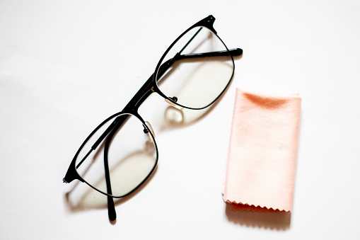 Sunglasses isolated on white background. Sunglasses mockup front view closeup design to apply to portrait. and a pink washcloth