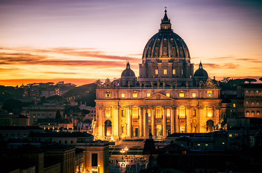 Rome, Italy - A view over St Peter's Basilica in the Vatican City after sunset.