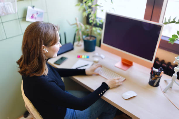 istock Woman working on her computer from home 1925060442