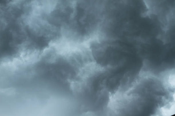 Dramatic, dark, blue cloudy sky overlay, Sky-overlays. Dramatic sky and lightning. Bad weather with dark clouds. Rain And Thunderstorm In Dramatic Sky