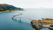 Aerial View of Car Driving Modern Sea Bridge to Island in Norway