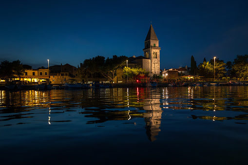 Medieval Osor Town Waterfront  in Evening Lights and Refelections in Water - Cres, Croatia