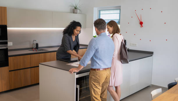 istock Couple And Real Estate Agent Checking Brochure 1925091446