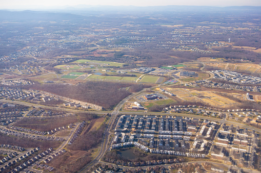 Virginia single-family developments from above,  around Dulles Airport, seen from plane window.