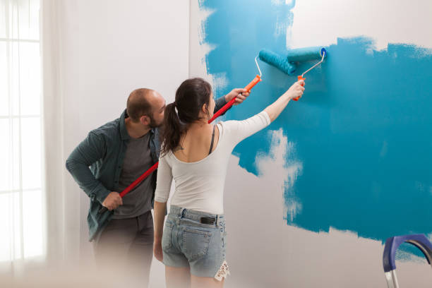 istock Wife helps her husband to renovate 1925114710