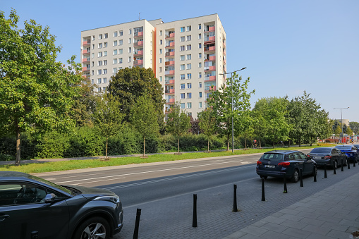 Warsaw, Poland - September 13, 2023: Block of flats and nature across the street in the Saska Kepa housing estate in the Praga-Poludnie district.