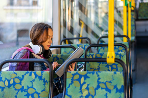 istock Young woman traveling by bus and using tablet. 1925124212