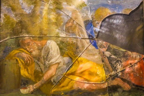 Cuenca, Castile-La Mancha, Spain- December 10, 2023: Painting of Biblical scene on broken stained glass in the Cathedral of Cuenca