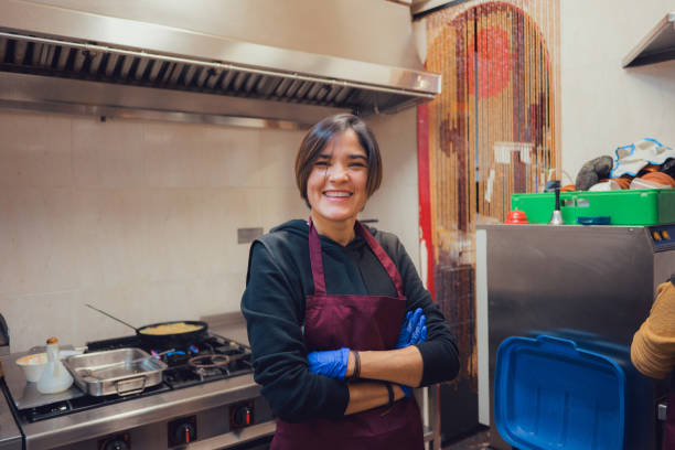 istock Professional chef smiling and looking at the camera in a kitchen of a restaurant 1925141046