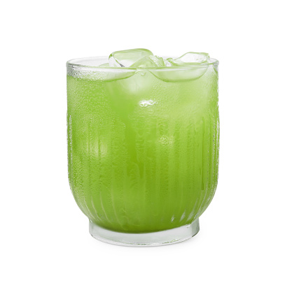 Glass of delicious iced green matcha tea isolated on white