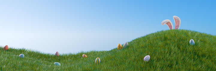 Easter banner. A rabbit hunts for colorful eggs in a meadow in the grass. 3D rendering