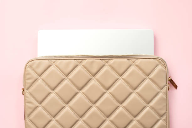 istock Laptop bag with laptop on pink background 1925184213