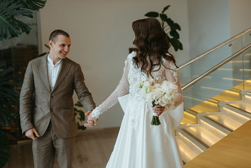 first meeting of the bride and groom on the hotel stairs