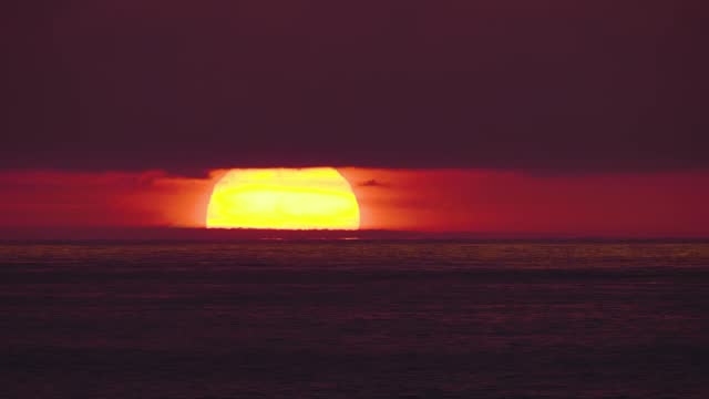 Sun disk rising over the horizon of the sea, sunrise, dawn