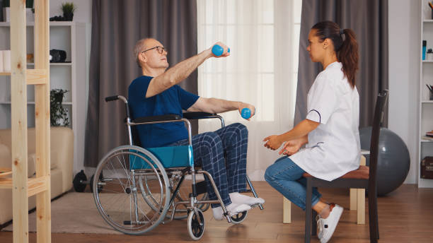 istock Elderly man in wheelchair exercising 1925210299