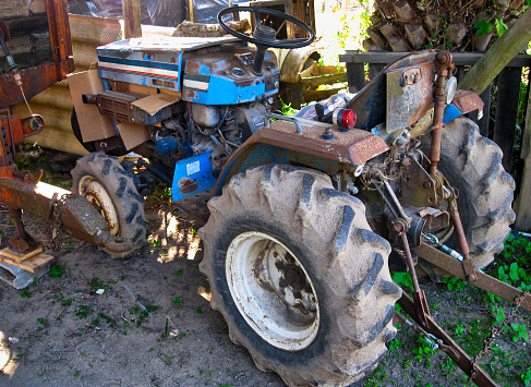 Rusty Old Farm Tractor Parked in an Agricultural Storage Area. Picture taken in Setubal - Portugal