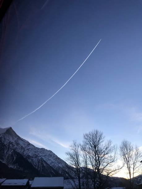 Several vapor trails crossing in the sky