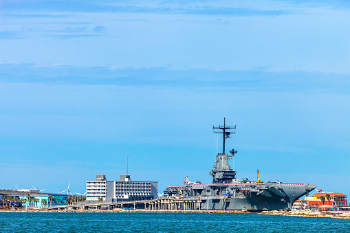 Honolulu, Awaii - May 3, 2019: Pearl Harbor, America flags on the road leading to  the Missoury Battleship
