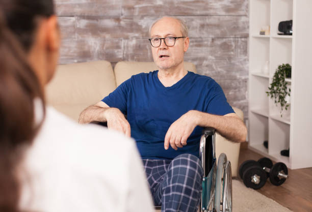 istock Man with disabilities consulted at home 1925251228