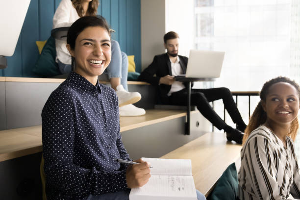 Happy Indian student woman attending educational business training