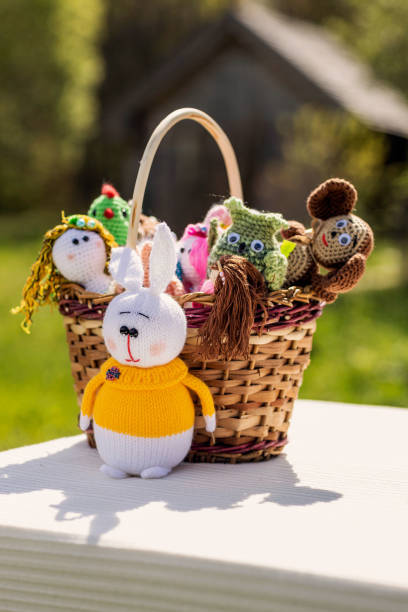 istock handmade dolls in a basket, taken on a sunny day 1925262183