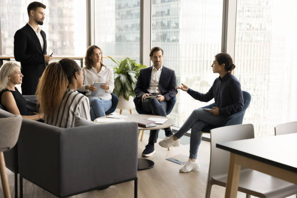 istock Young Indian business professional speaking on team brainstorming meeting 1925271163