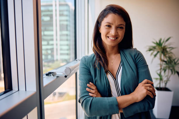 istock Confident businesswoman standing in the office and looking at camera. 1925293257