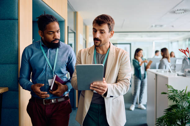 istock Male entrepreneurs cooperating while working on digital tablet in the office. 1925294851