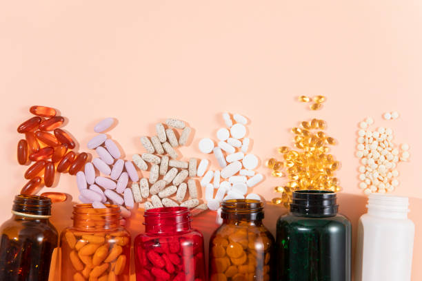 pills background - nutritional supplement fish oil vitamin pill bottle ストックフォトと画像