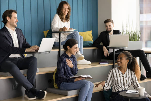 istock Happy multiethnic team talking at corporate meeting, having fun 1925320756