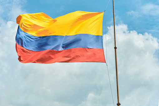Colombia flag with blue sky